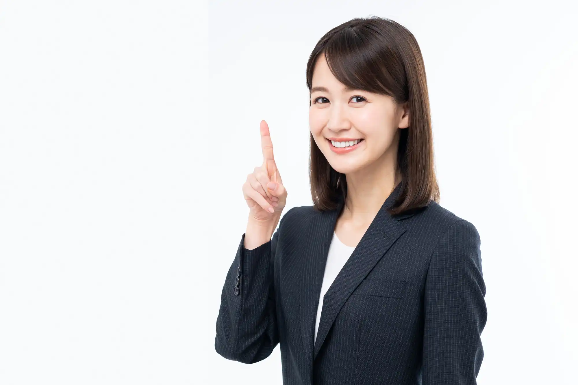 人差し指を立てている女性